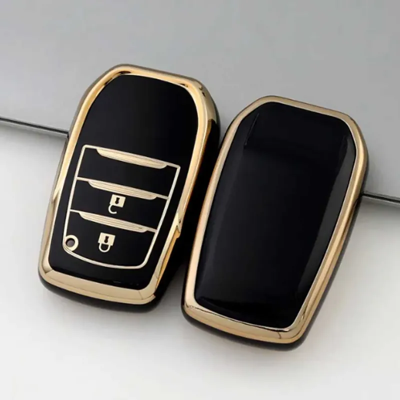 Bestseller Toyota 2 gombos TPU kulcstok - Fekete-arany / Kék-arany / Fehér-arany